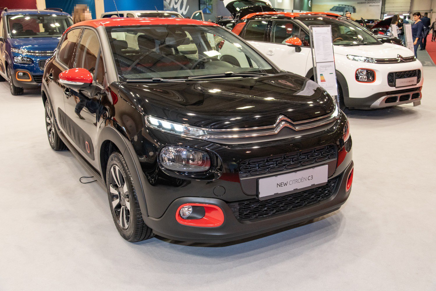 Front view of compact hatchback with unique headlight and fog light design