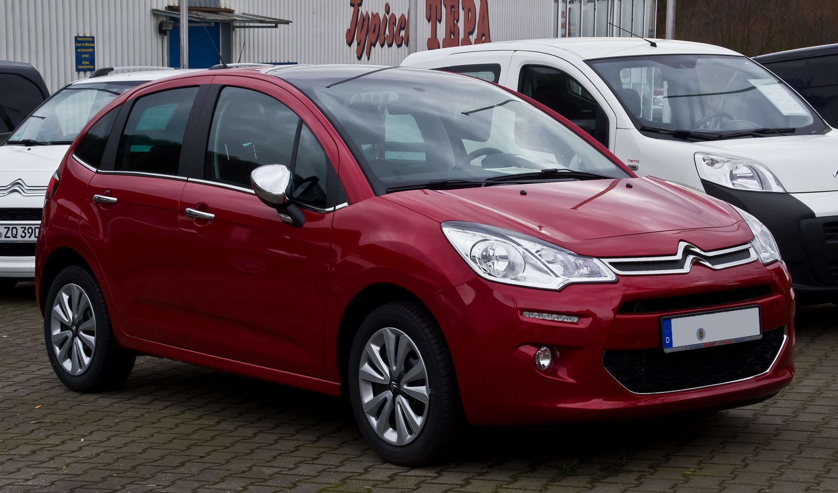 Compact hatchback front with LED daytime running lights and alloy wheels