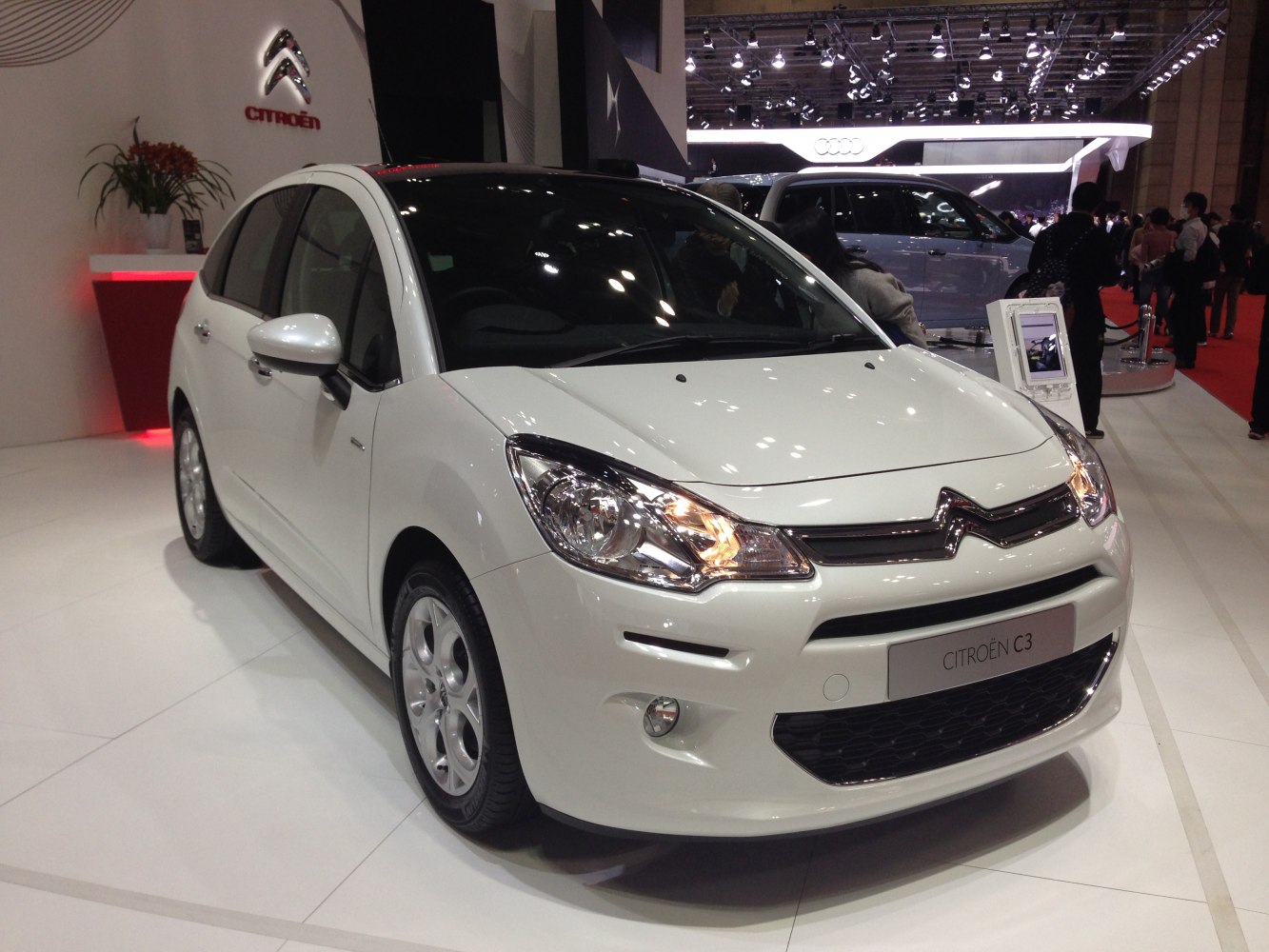 White compact hatchback with distinct headlights and smooth body lines