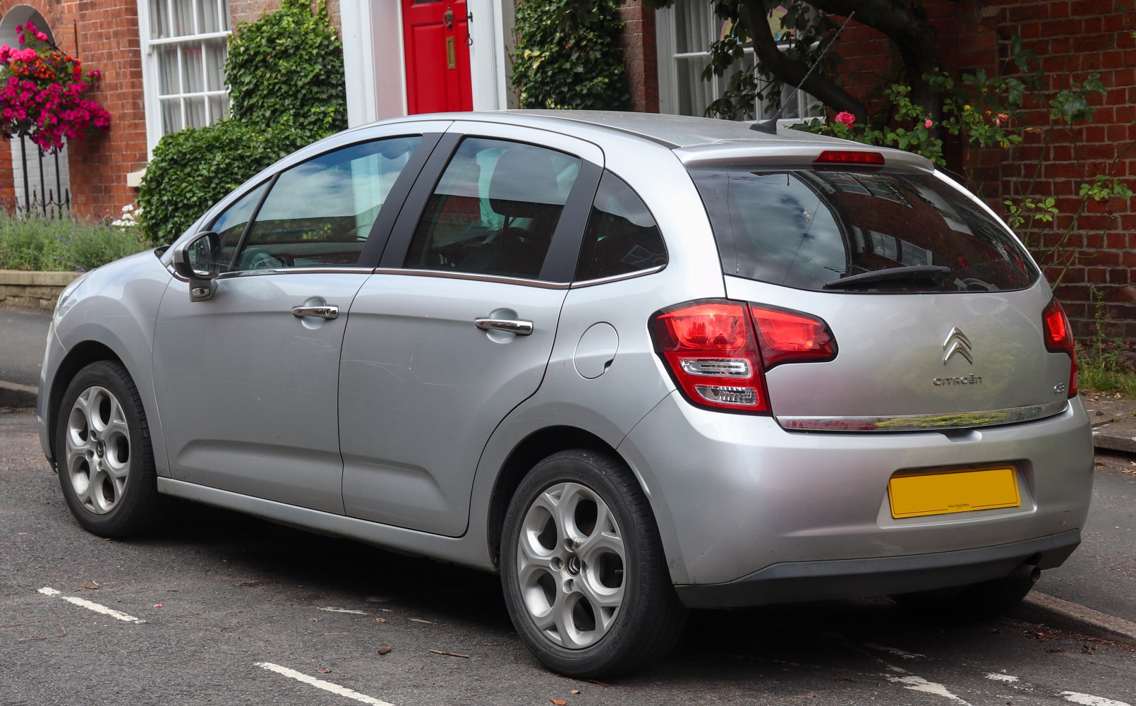Silver compact hatchback with distinctive rear lights and alloy wheels
