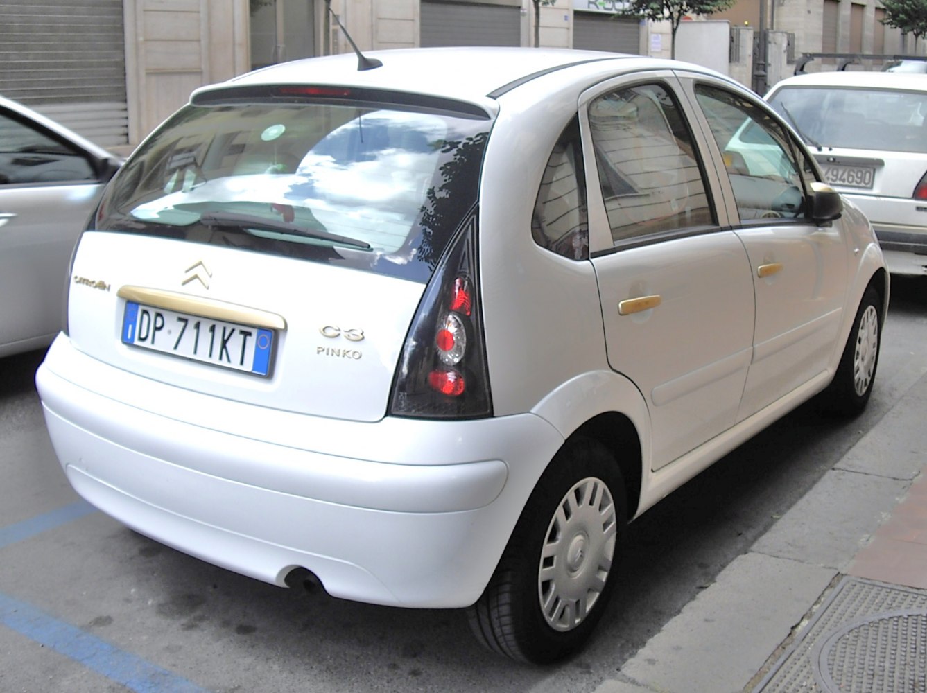 Rear and side view of compact hatchback with distinctive taillights