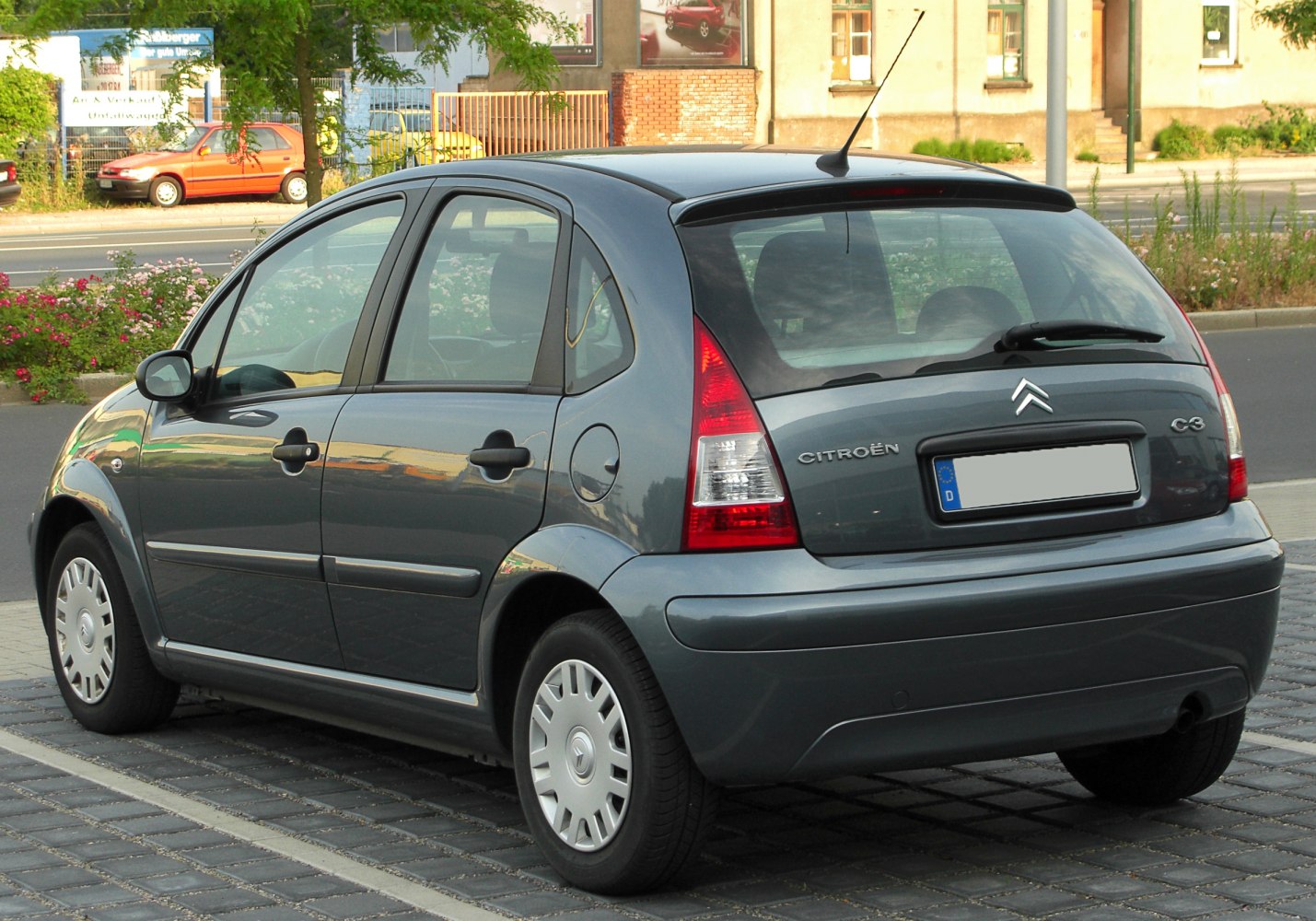 Rear side view of a compact five-door hatchback with distinctive taillights