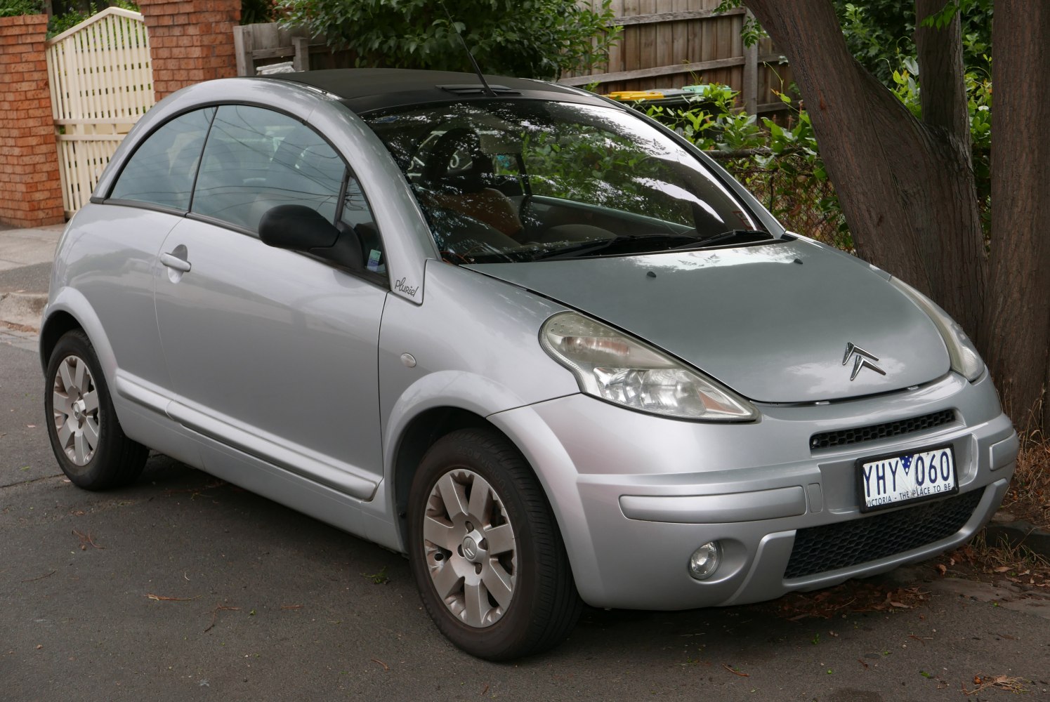 Compact two-door hatchback with rounded body and distinctive headlights