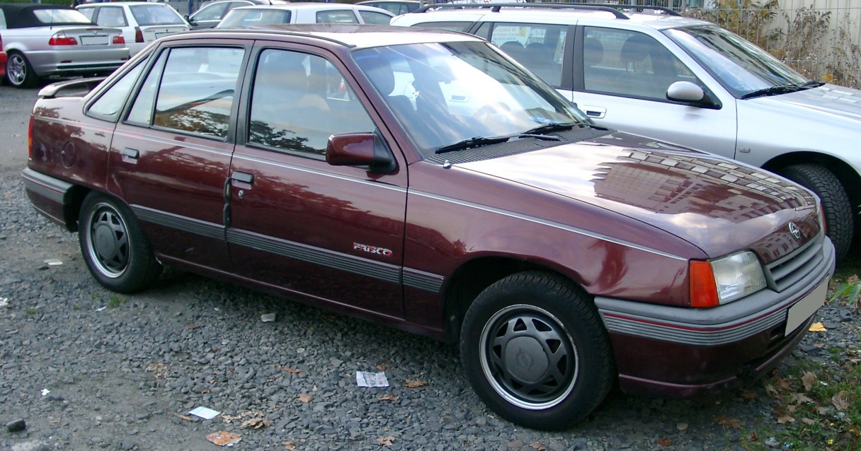 Side view of classic 1980s four-door hatchback with distinct trim and alloy wheels