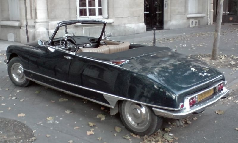 Vintage convertible with leather interior and distinct rear lights