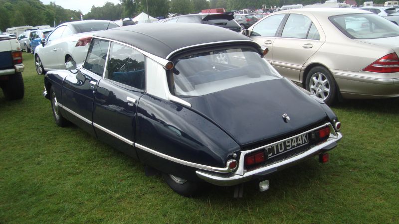 Classic vintage car with unique rear design and hydraulic suspension.