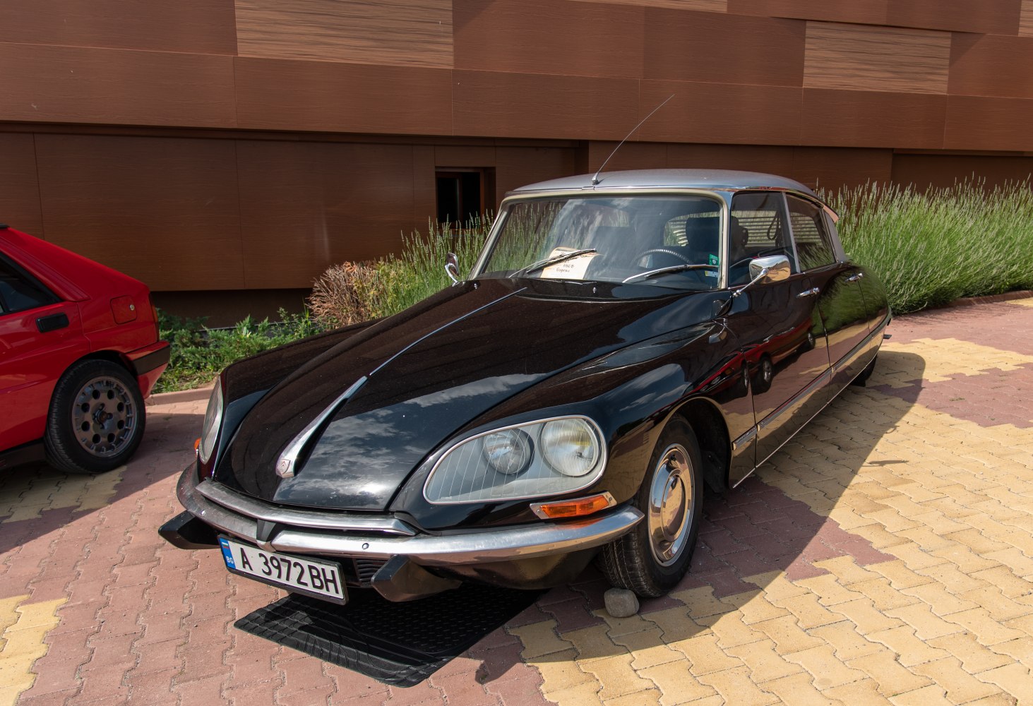Classic car front end with sleek headlights and chrome details