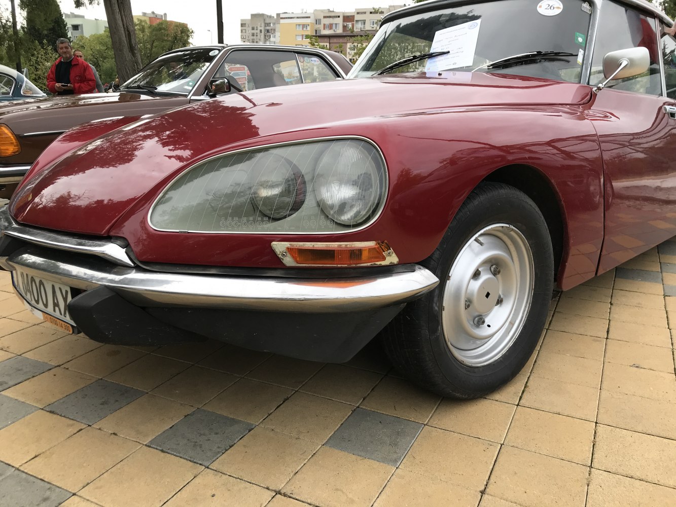Close-up of front car end with distinctive headlights and chrome bumper