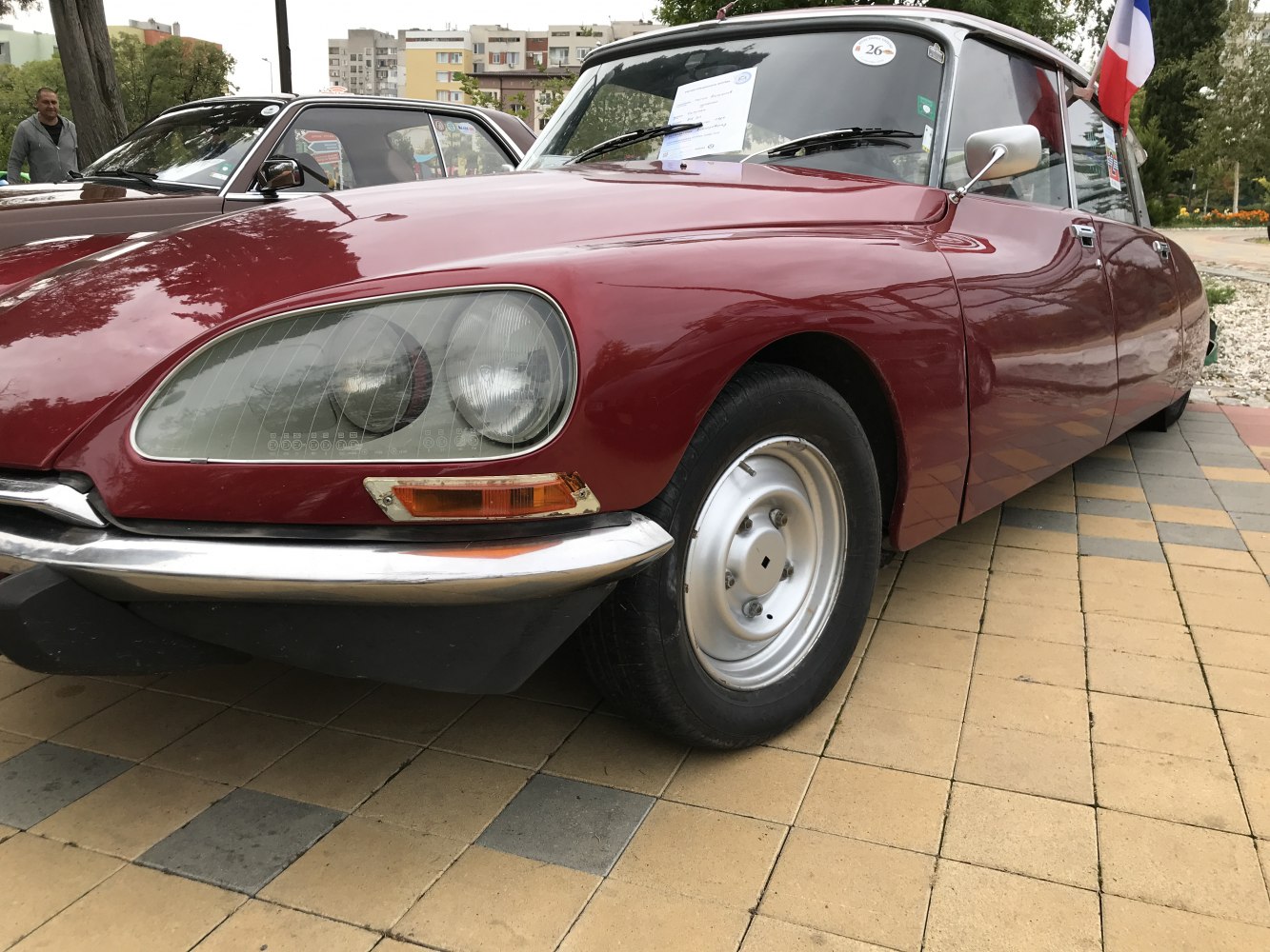 Classic rounded headlights and smooth curved body of a vintage retro car front