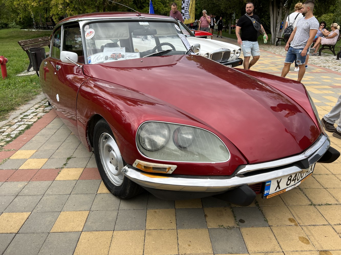 Distinctive front view with iconic headlights and sleek hood design