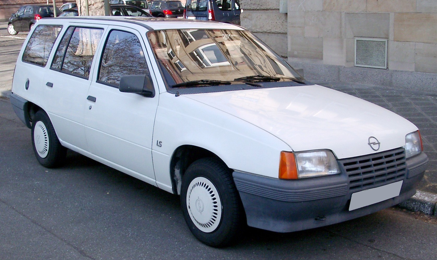 Front-side view of a 1980s station wagon with distinctive rectangular headlights and wide grille