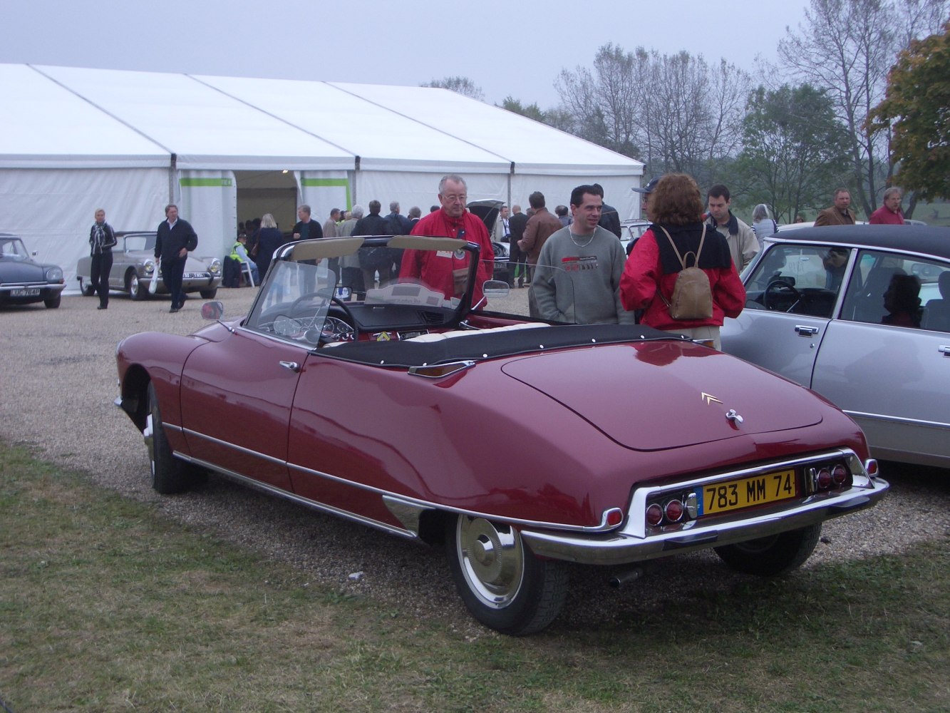 Classic convertible with rounded rear and vintage wheels