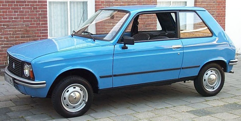 Vintage compact hatchback with simple design and steel wheels