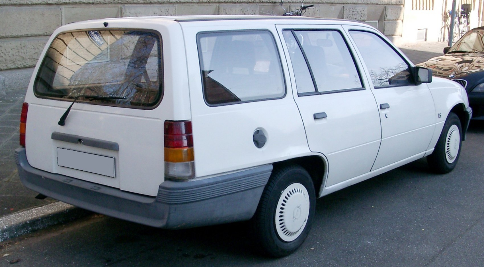 Rear and side view of classic station wagon with distinctive boxy shape.