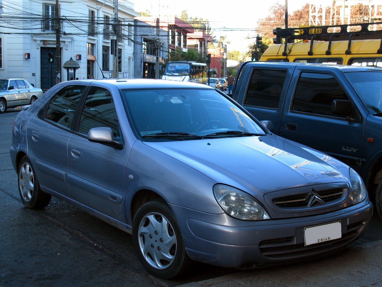 Front headlights and side profile of a compact sedan