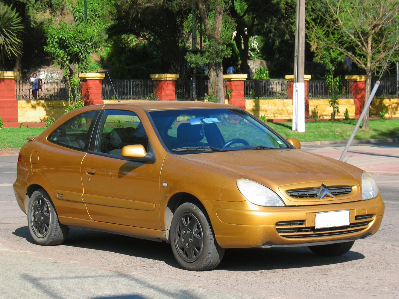 Compact coupe with rounded headlights and distinctive front grille