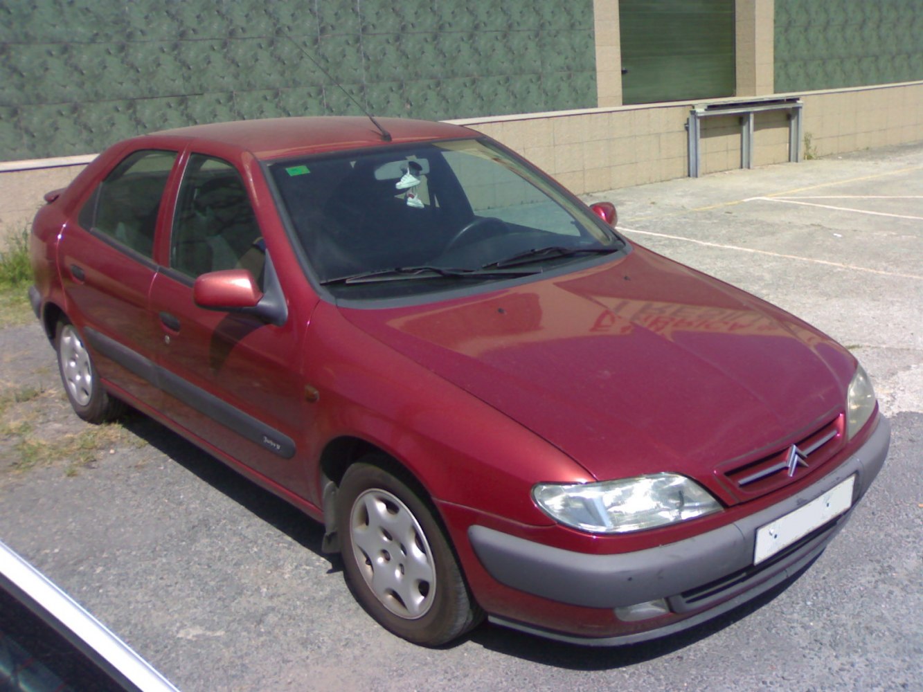 Front and side exterior view of a 1997 compact sedan