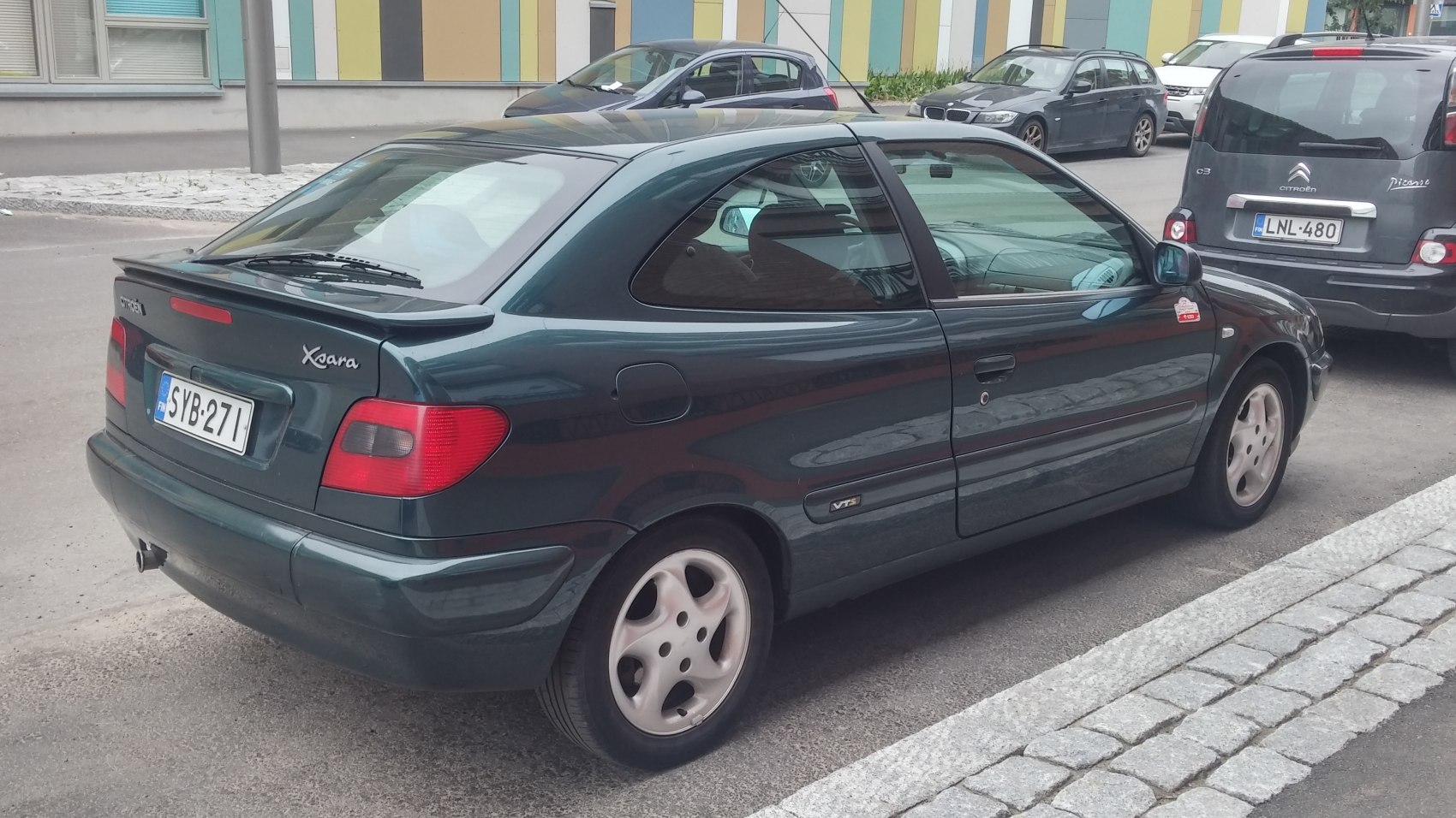 Two-door coupe with rear spoiler and alloy wheels