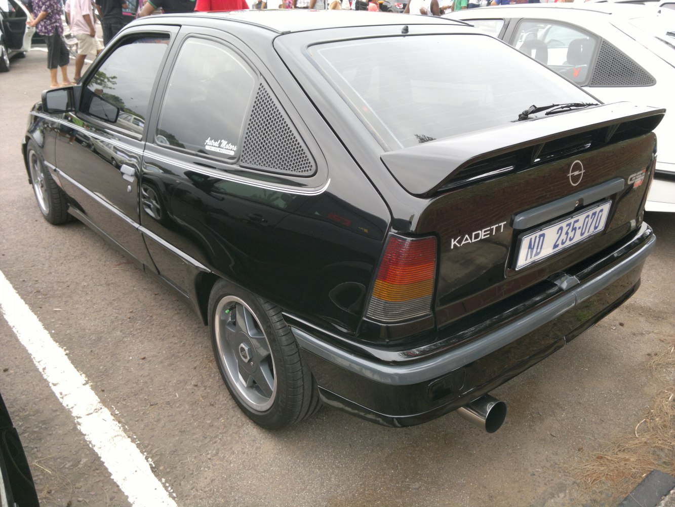 Rear hatchback with spoiler and alloy wheels