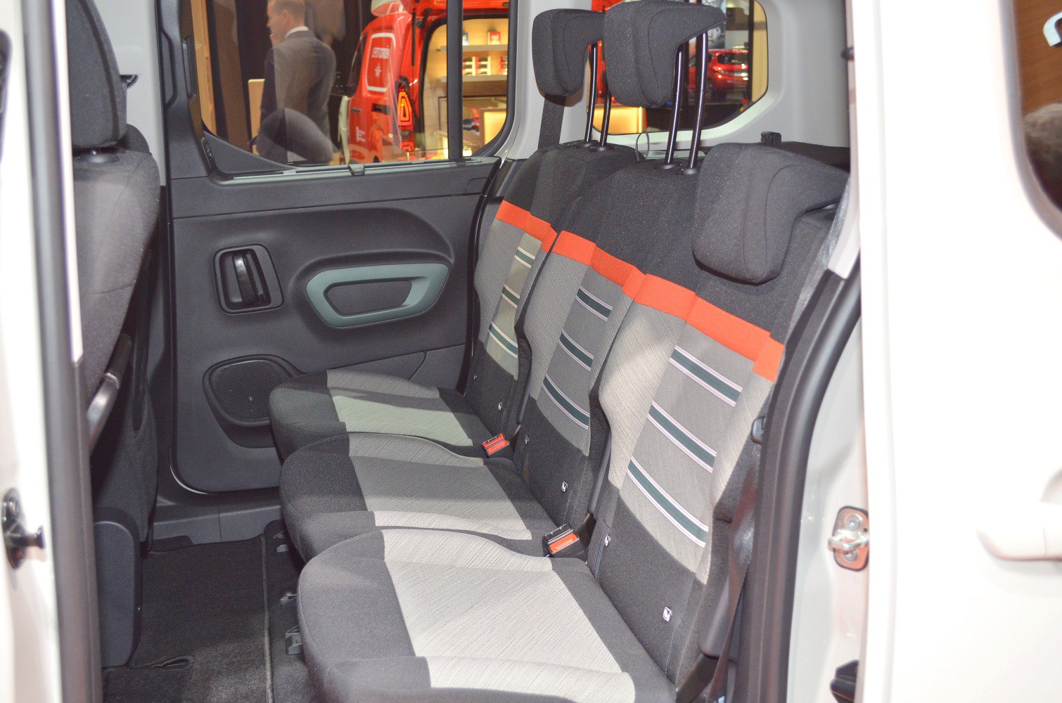 Rear passenger seats with fabric upholstery and headrests