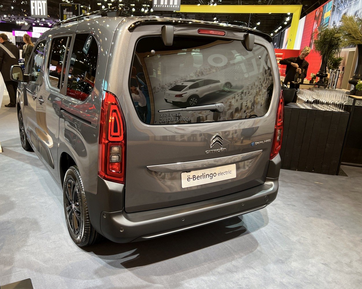 Rear view of an electric compact van with LED taillights and rear wiper