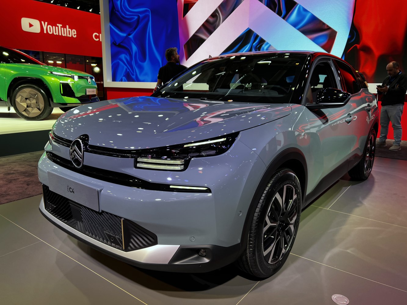 Sleek front design with slim LED headlights and accented grille.