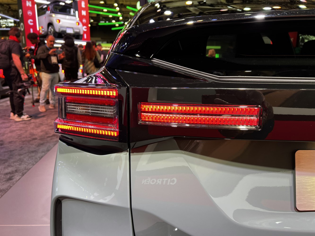 Close-up of red LED rear taillights with modern, structured design
