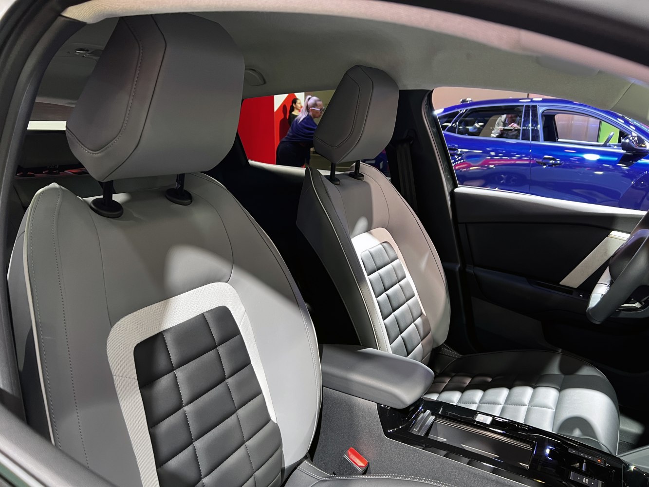 Modern ergonomic front seats with premium upholstery and detailed stitching.