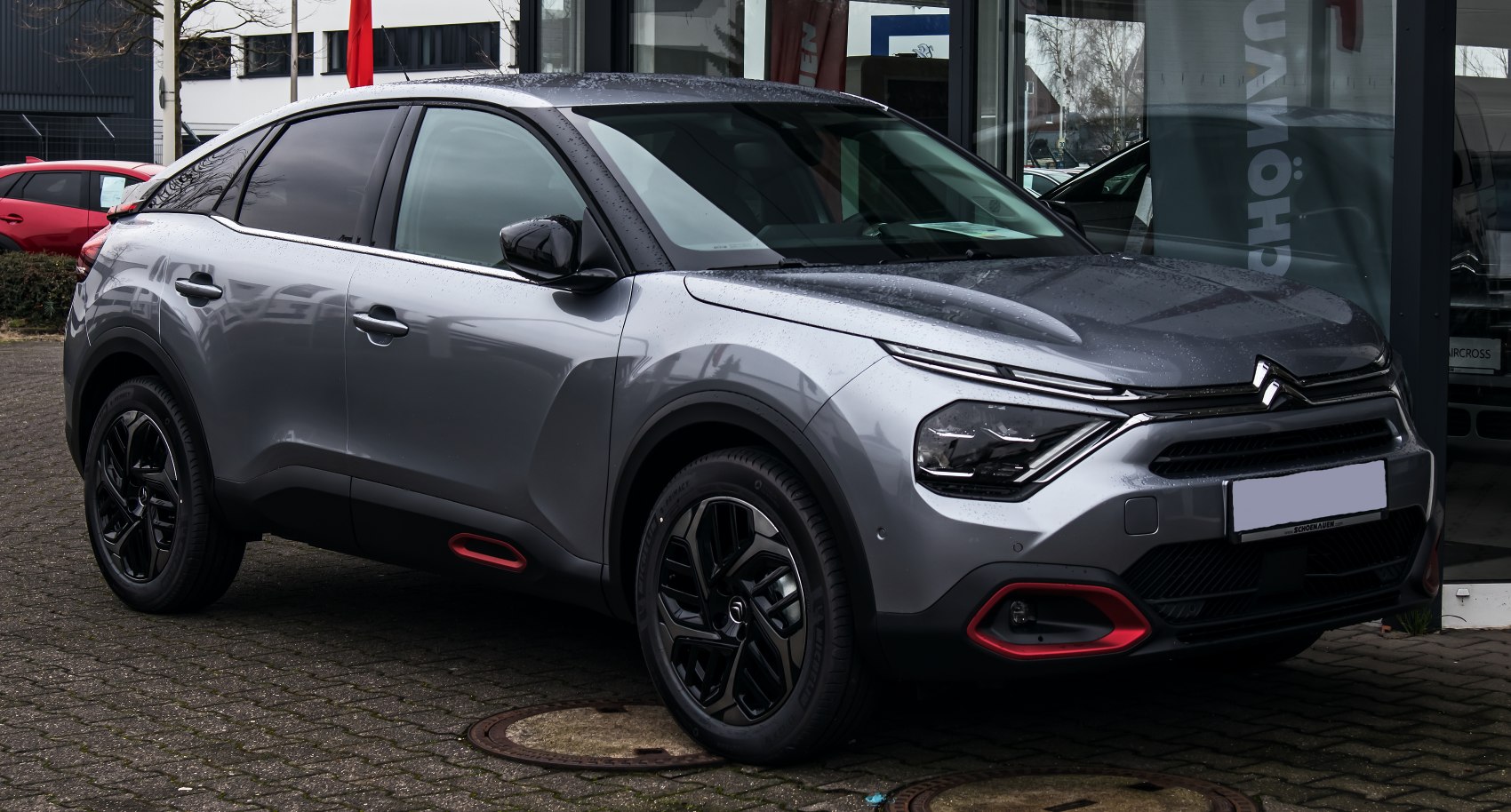 Front-side view with distinctive headlights and sporty aerodynamic shape