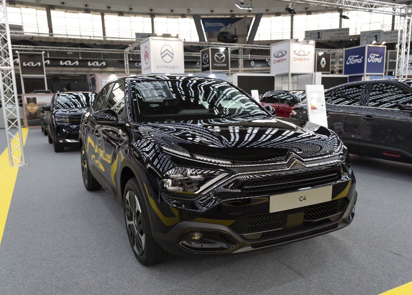 Black compact SUV with LED headlights and bold grille front view