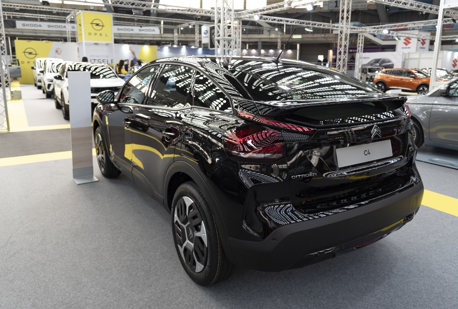 Rear view of sleek black hatchback with modern taillights and dynamic design