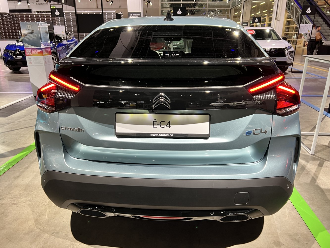 Rear view with LED tail lights and sleek hatchback design