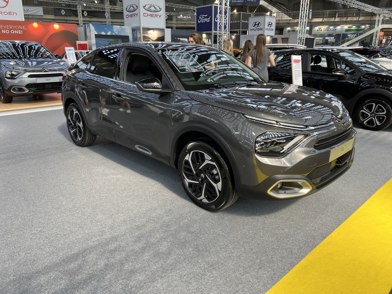 Front LED headlights and stylish alloy wheels on a modern vehicle