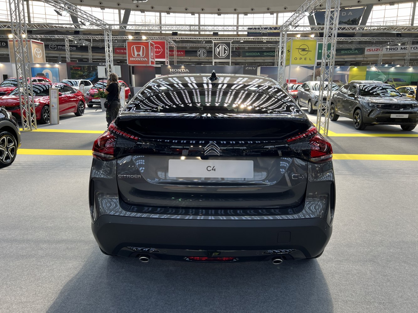 Rear view with sleek tail lights and dual exhausts of a modern hatchback