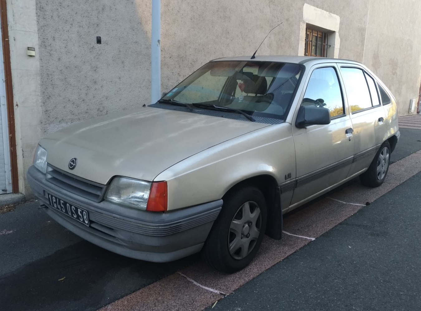 1980s hatchback front-side angle with rectangular headlights