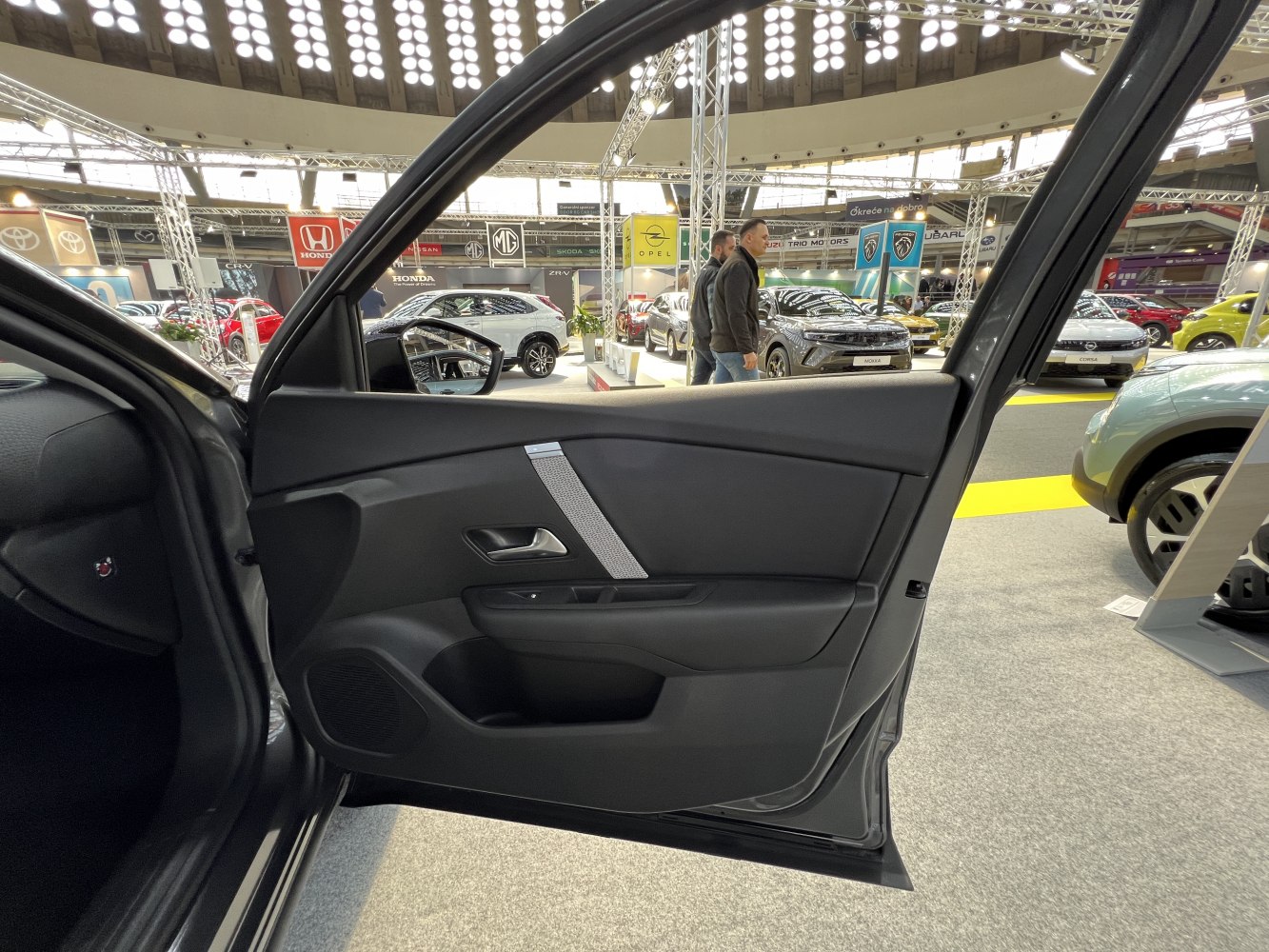 Front interior door panel with handle and speaker grille