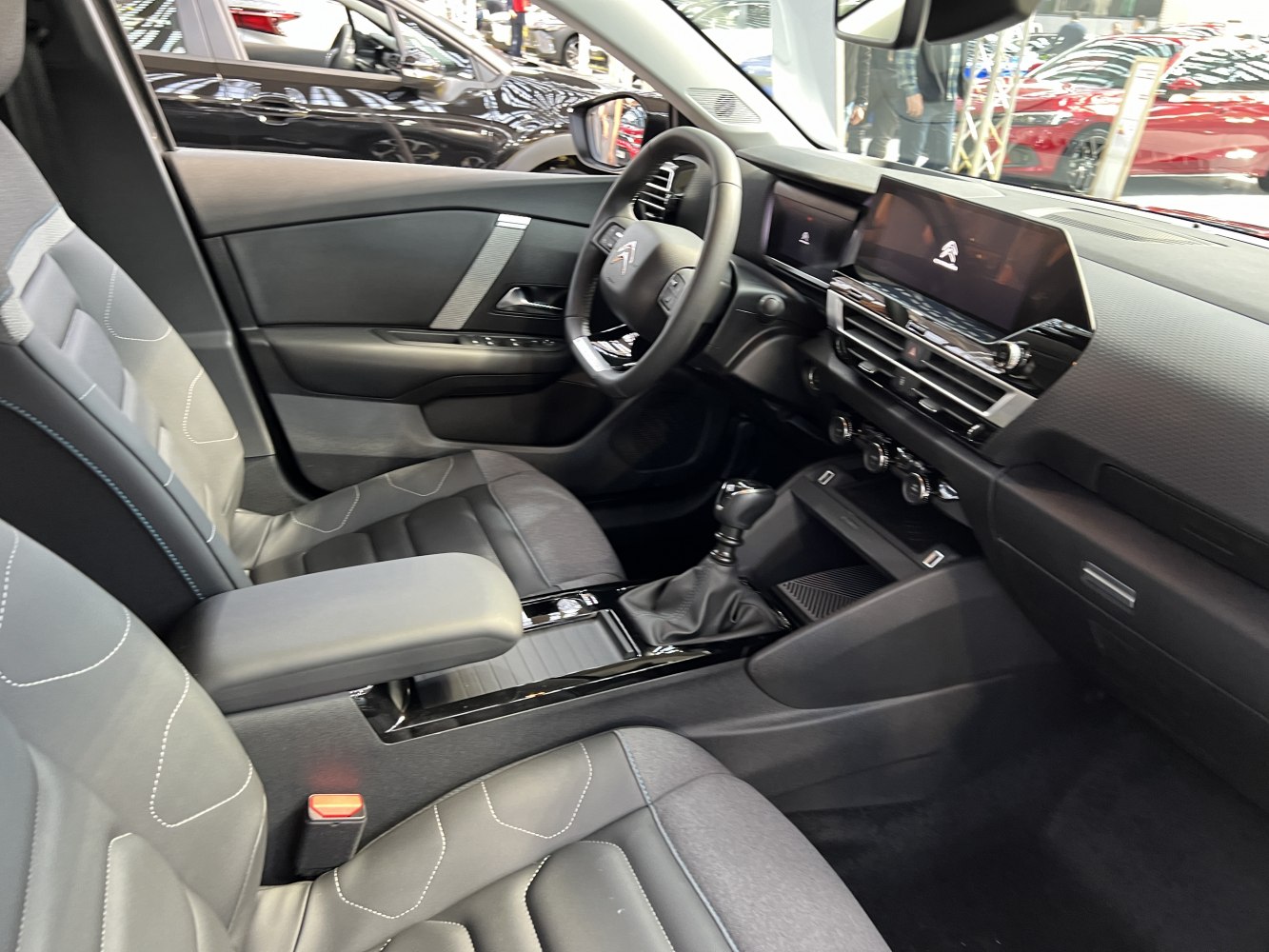 Modern car interior with digital dashboard and ergonomic seating
