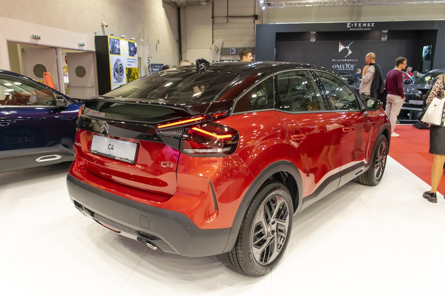 Rear side view with modern LED taillights and black roof