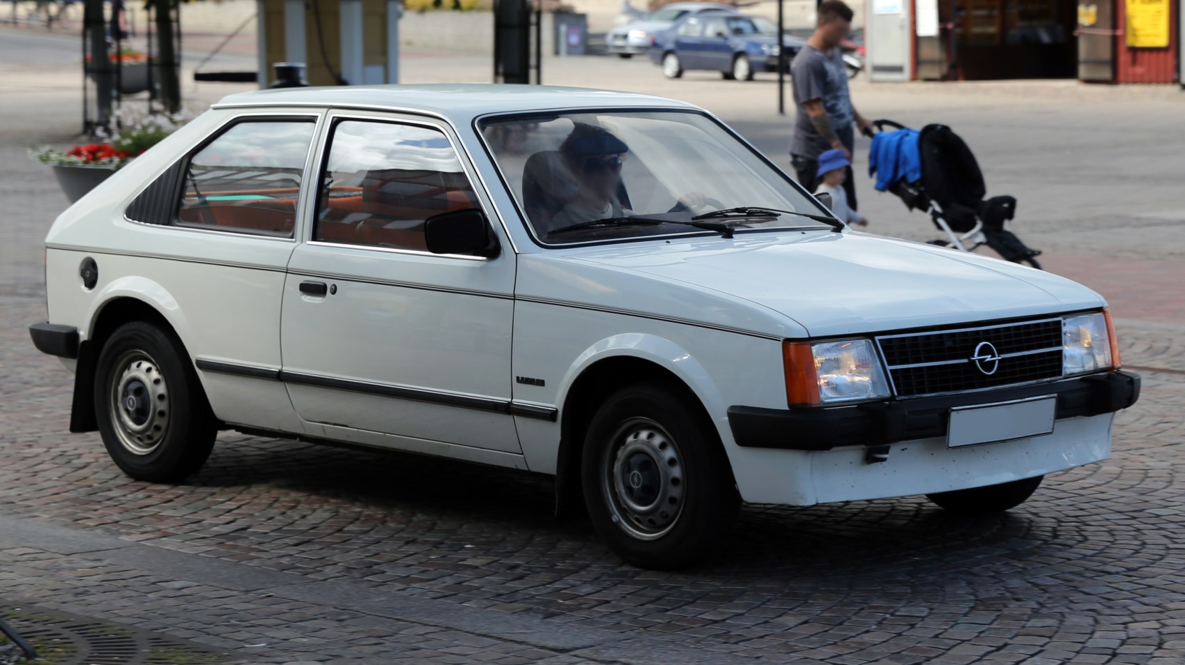 3-door hatchback with distinct front grille and rear side profile