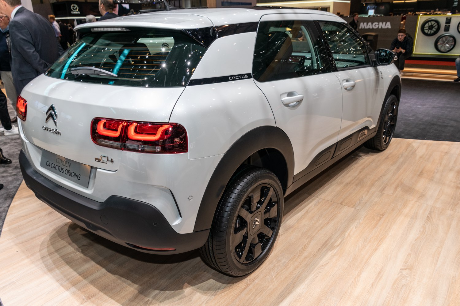 Rear and side view with distinct taillights and black-accented rims