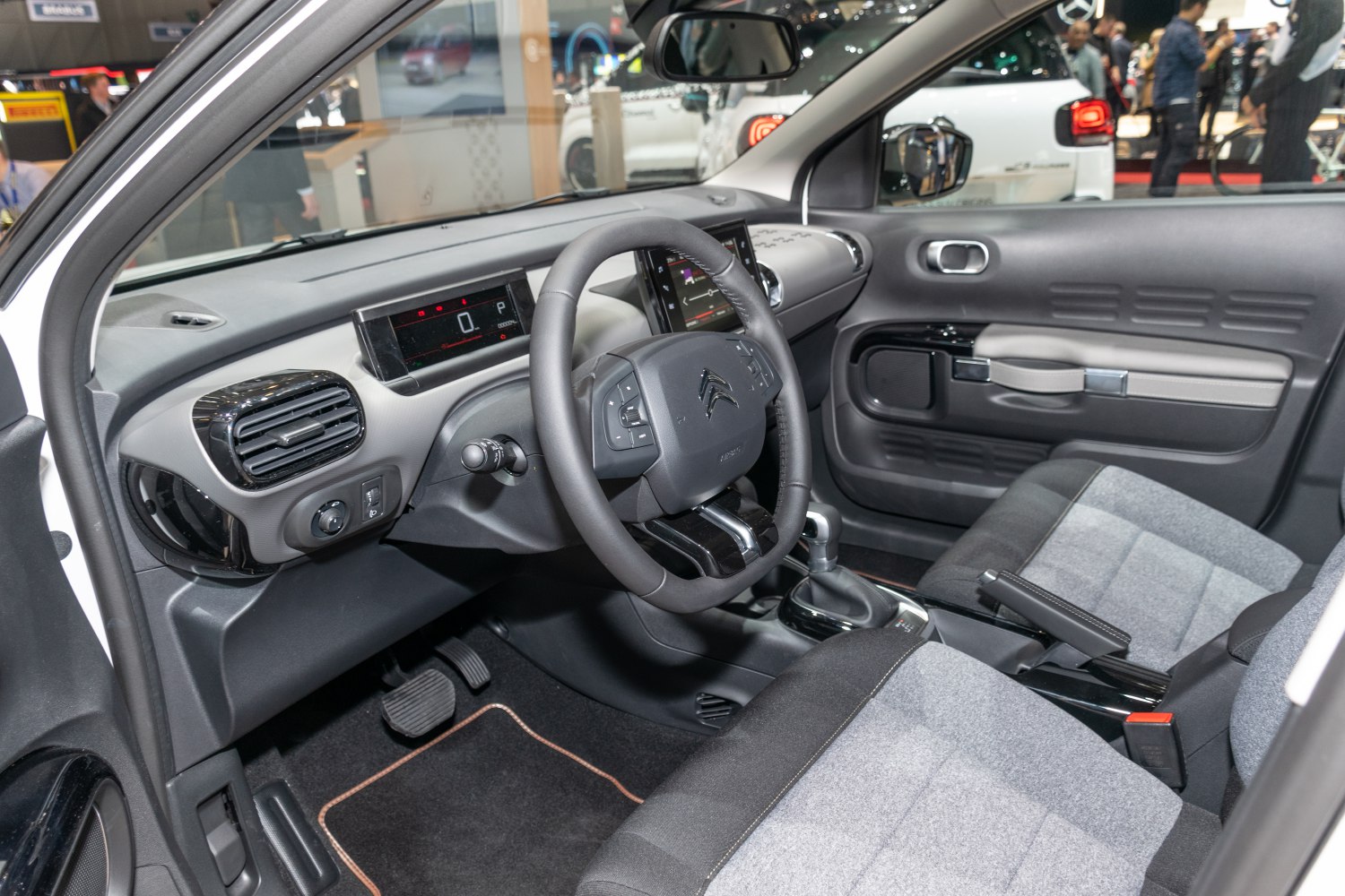 Dashboard, steering wheel, and front seats interior view