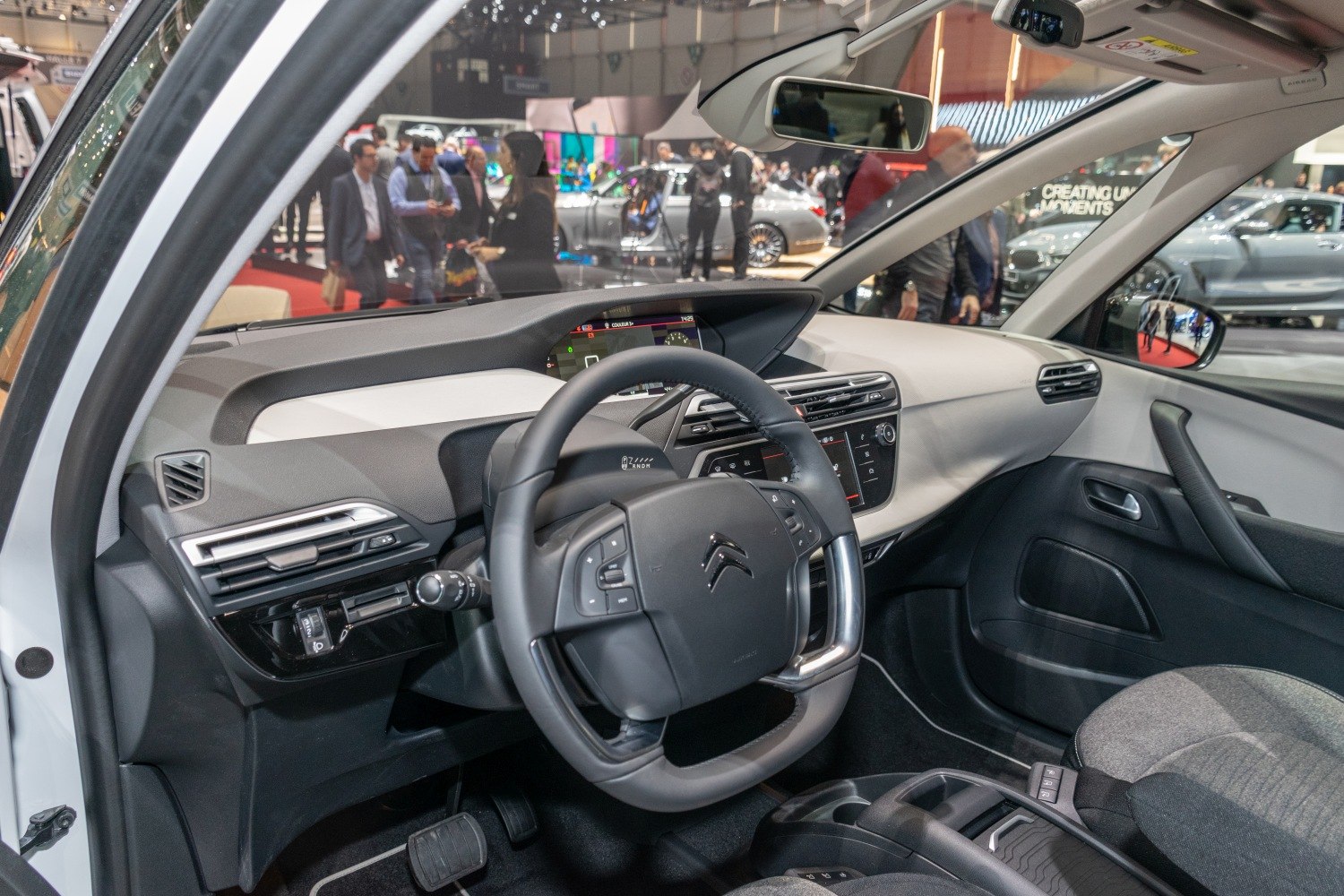 Modern digital dashboard and distinctive square steering wheel