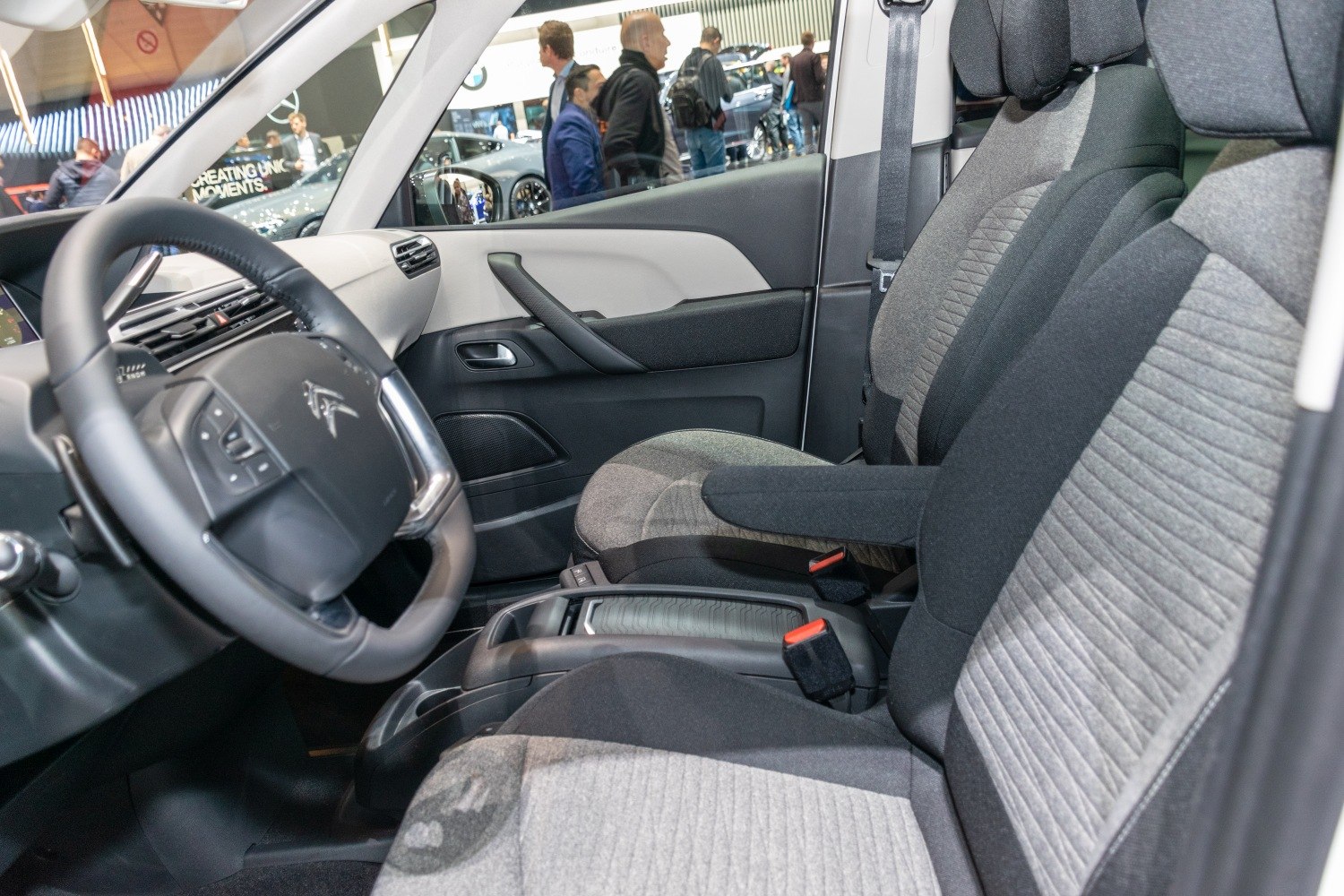 Detailed view of ergonomic seats and multifunction steering wheel.
