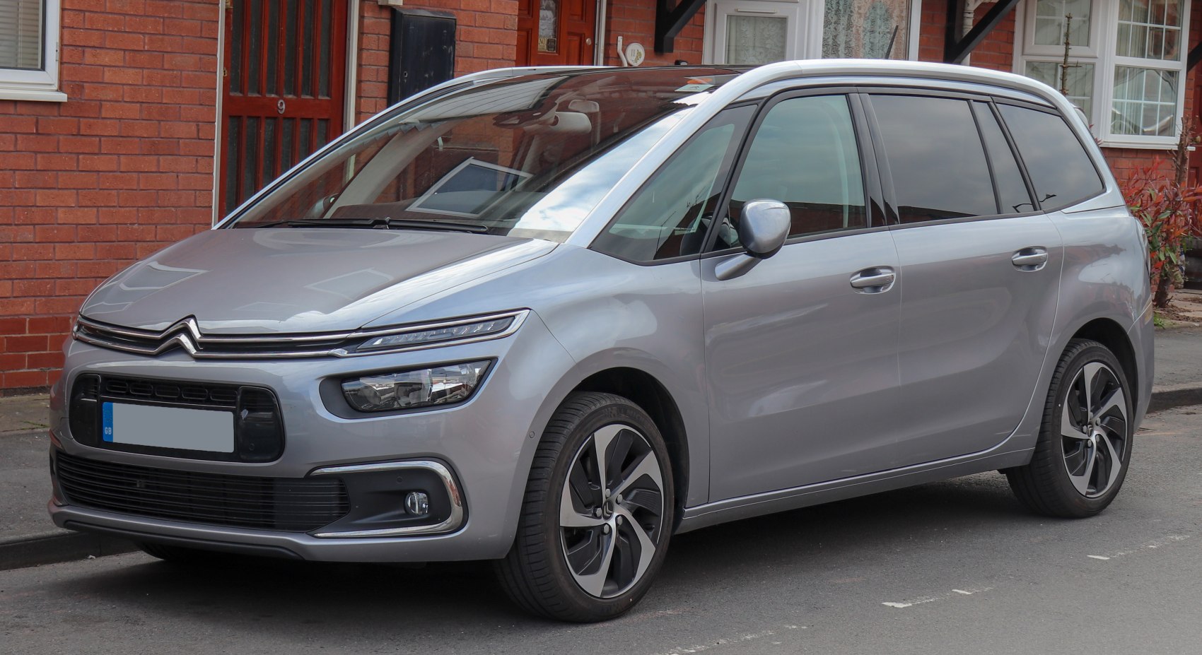 Silver MPV with split LED headlights and alloy wheels.