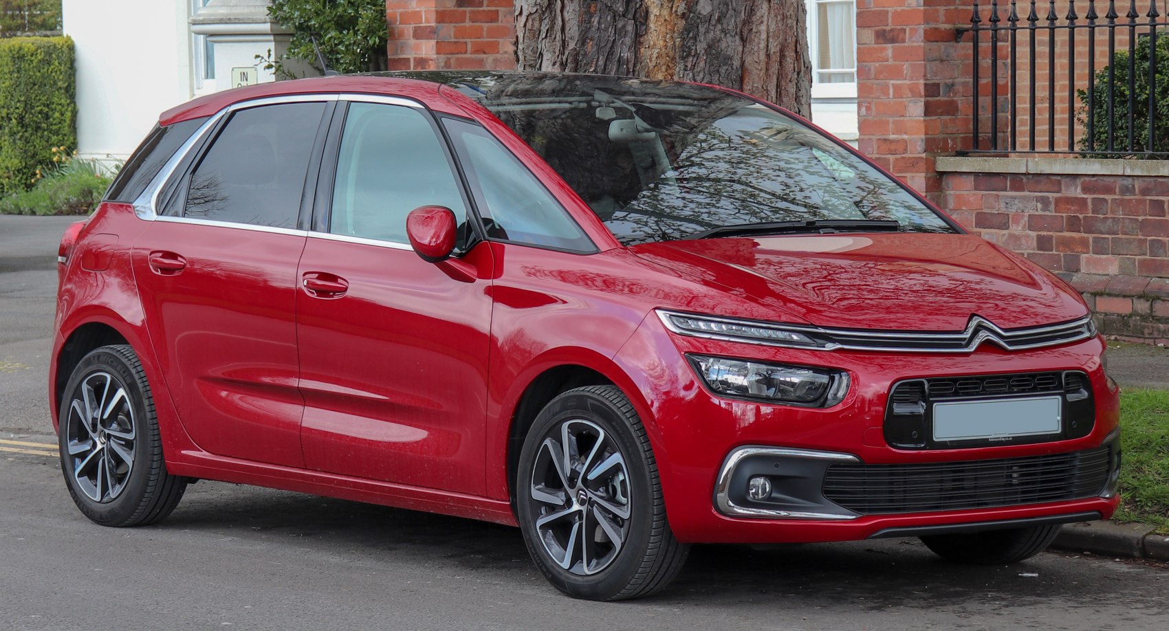 Red compact hatchback with LED headlights and alloy wheels