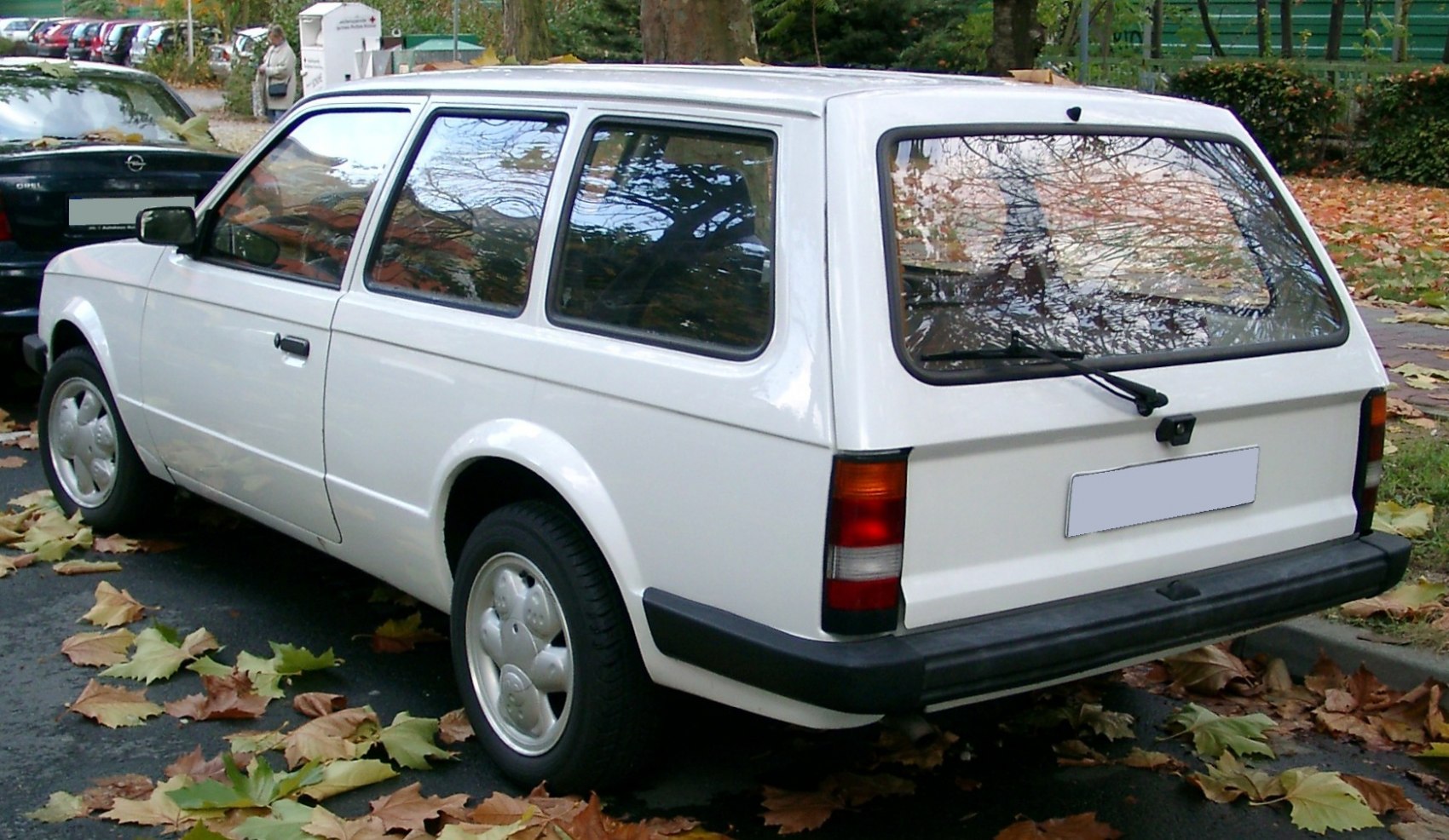 Rear and side view of a classic station wagon with black bumper and large windows