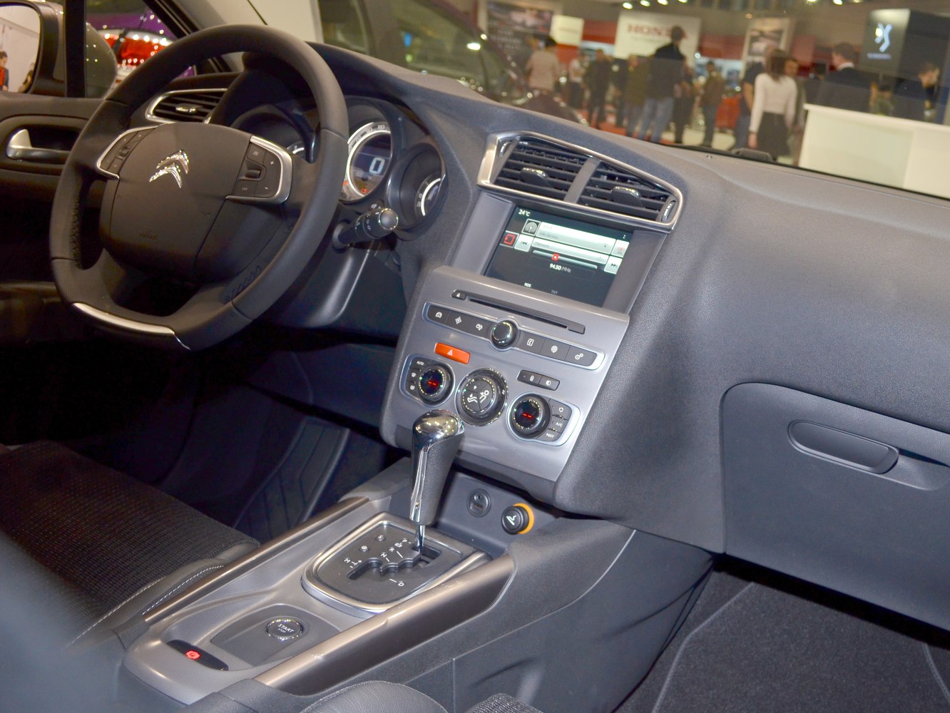 Dashboard layout with infotainment screen and automatic gear shift