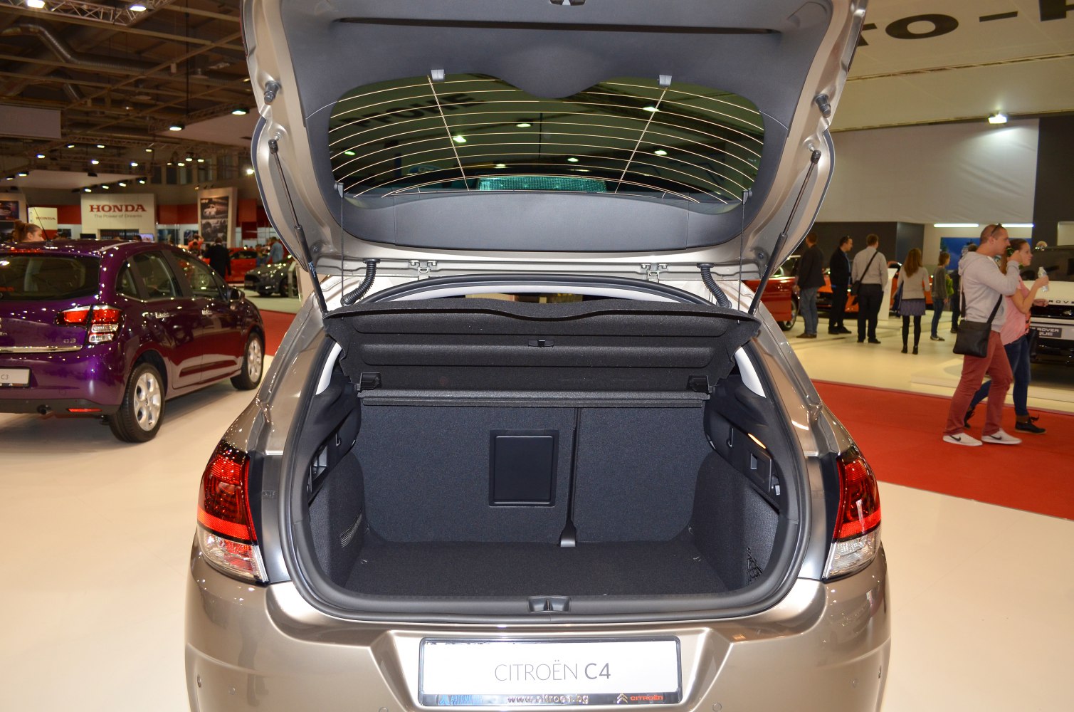 Open hatchback trunk interior with spacious cargo area and dark lining.