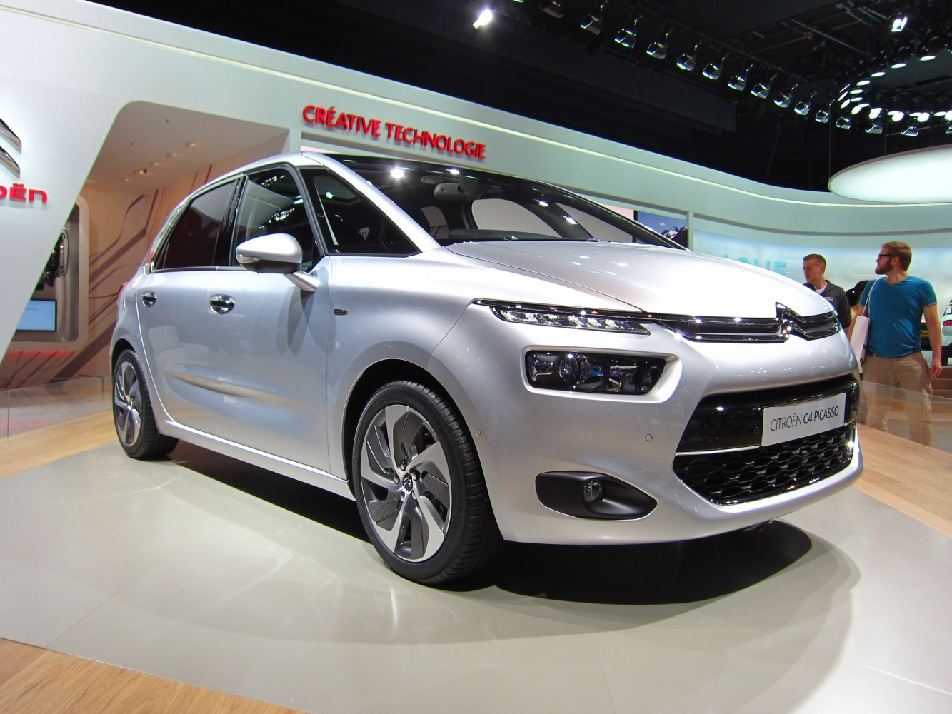 Front-side view of silver MPV with LED headlights and alloy wheels