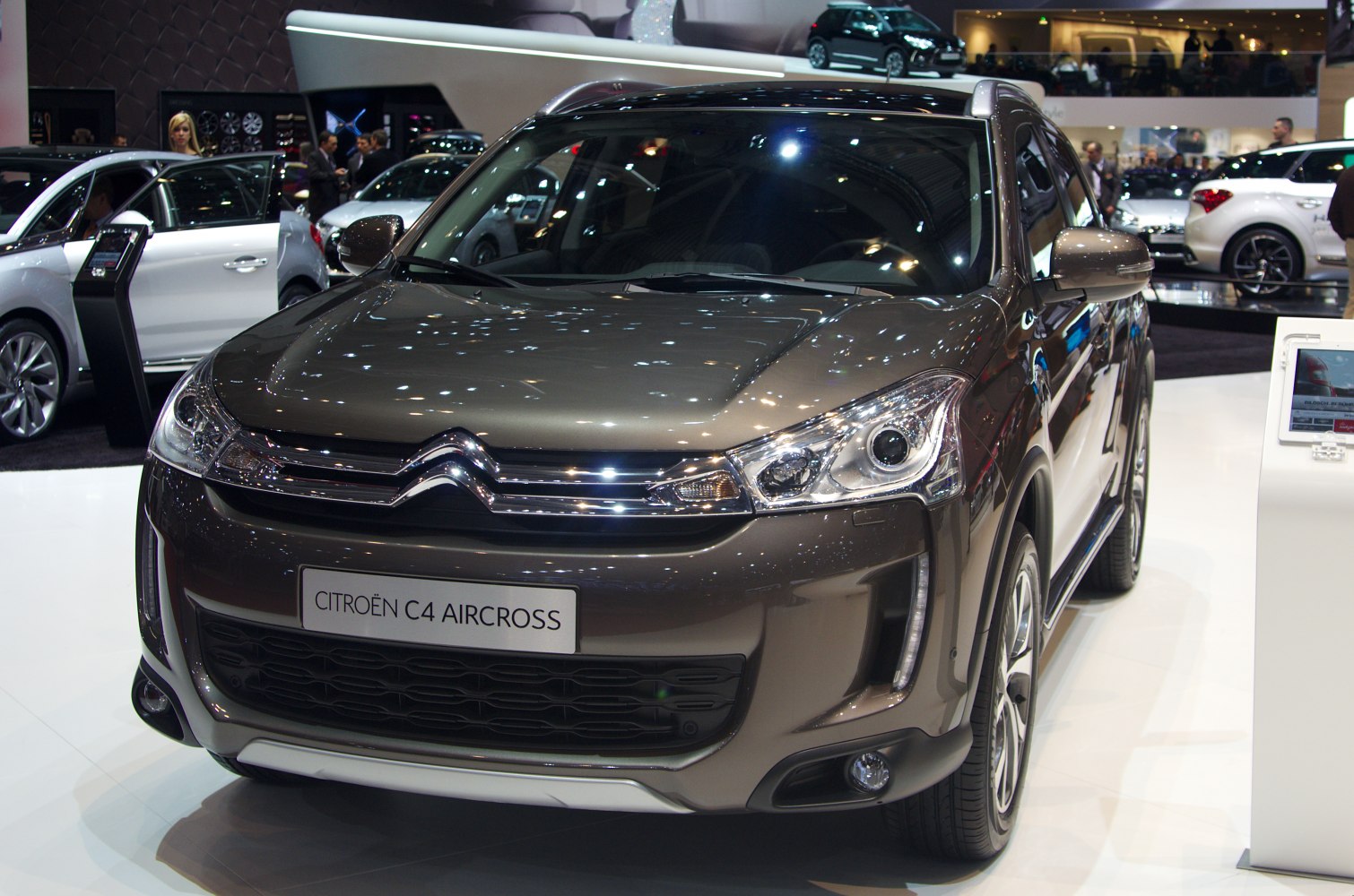Front view of 2012 SUV with sleek headlights and distinctive grille